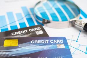 Credit card model on chart and graph spreadsheet paper. Finance development, Banking Account, Statistics, Investment Analytic research data economy, Stock exchange trading, photo
