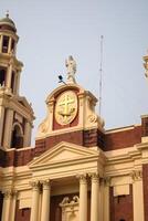 A large building with a clock on top photo