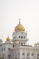A white building with gold domes photo