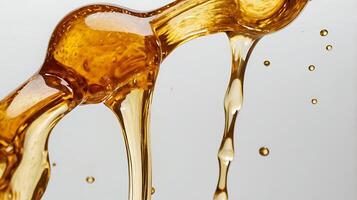 Detailed close-up of honey dripping with a focus on its texture and color photo