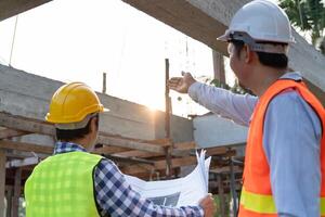 engineer and owner project is inspecting construction and quality assurance new house. Engineers or architects or contactor work to build the house before handing it over photo