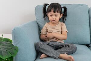 Children have abdominal pain, indigestion, gastritis, menstrual cramps, flatulence, diarrhea, distention, colon cancer, belly inflammation problem, suffer food poisoning, abdomen. photo