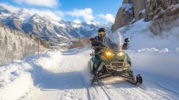 A man riding a snowmobile down a snowy road photo
