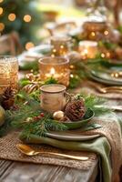 A table setting with christmas decorations and candles photo