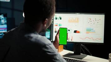 Financial manager doing accounting work on pc with chroma key screen, examining expenses for legal analysis at home setup. African american advisor working on reducing monthly costs. Camera A. video