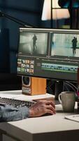 Vertical maker editing montage clips on coloring software at home, working on color correction and motion graphics to edit footage. Content creator editing clips on toolbar panels. Camera B. video