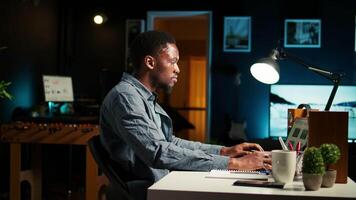 Expert in finance reads funding distribution details from records before building strategy on expenditures and profits. Auditing operations handled at home, financial planning. Camera A. video