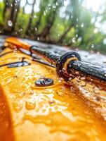 A close up of a kayak with water droplets on it photo
