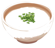 A bowl of creamy white soup topped with chopped green onions png