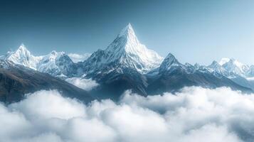 A mountain range is seen in the clouds photo