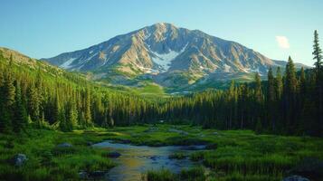 A mountain range with a stream running through it photo
