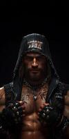 Intense portrait of a rugged warrior with tattoos and a hood in a dark dramatic setting for edgy mobile wallpaper design photo