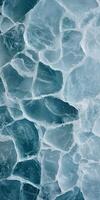 Frosted Ice Texture with Cracked Patterns and Translucent Blue Surface in a Frozen Design photo