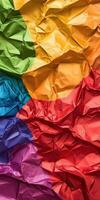 Crumpled colorful paper texture with vibrant rainbow gradient ideal for abstract backgrounds photo