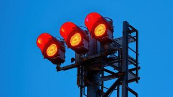 Industrial Red Signal Lights on Tower Against Evening Sky, Emphasizing Safety and Structural Design photo