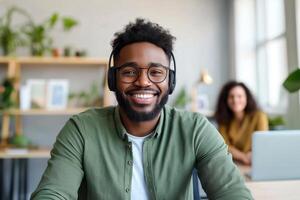 Smiling Professional Man with Headset Working in Modern Office, Engaged and Friendly Expression, Concept of Customer Support and Remote Communication photo