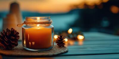 Cozy Candle Jar with Pinecone at Sunset, Perfect for Relaxation and Autumn-Themed Scenes photo