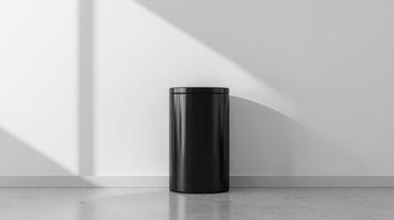 Modern Black Trash Can in Minimalist Interior Design Setting With Clean Lines and Natural Light in a Simple White Room photo