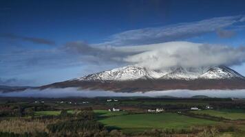 Scenery of an early morning when the sun rises over the Ireland Nephin mountain range. Cloudy mountain fog and mist on the valley video