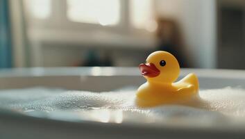 A rubber duck floating in a bathtub photo