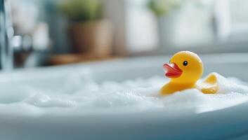 A rubber duck is sitting in a bathtub photo