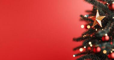 A festive Christmas tree adorned with a star and ornaments against a red backdrop. photo