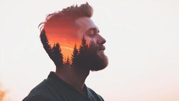 A double exposure of a man and a sunset with trees. photo
