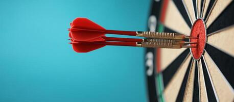 Three red darts embedded in the bullseye of a dartboard. photo
