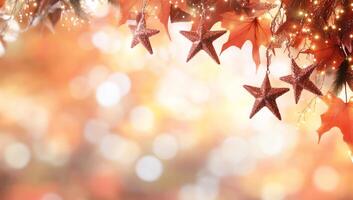 A festive background featuring stars and autumn leaves with warm bokeh. photo