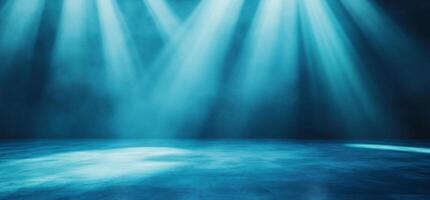 A dramatic stage with blue lighting and a misty atmosphere. photo