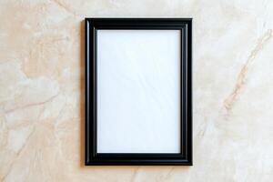 A blank picture frame on a textured surface, ready for artwork. photo
