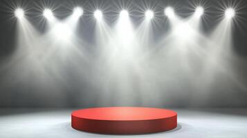 A red circular stage illuminated by bright spotlights. photo