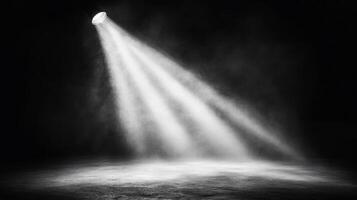 A spotlight illuminates a dark space, creating a dramatic atmosphere. photo