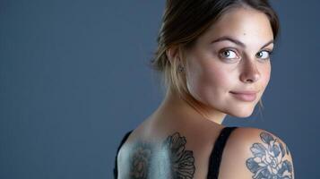 A woman with a tattoo on her back photo