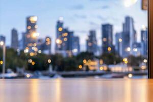 A blurred city skyline at dusk with lights and reflections. photo