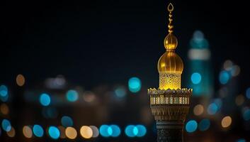 Night view of a mosque's golden dome and minaret illuminated. photo