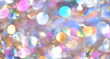 A vibrant, shimmering background of colorful bokeh lights. photo