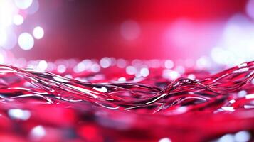 Abstract red and silver strands with blurred lights in the background. photo