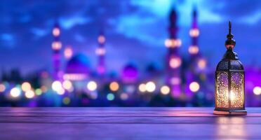 A decorative lantern on a wooden surface with a blurred cityscape backdrop. photo