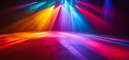Colorful stage lights illuminating a dark space for performance. photo