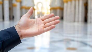 An outstretched hand in a grand architectural space. photo