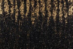 A shimmering pattern of black and gold glitter, creating a striking visual. photo