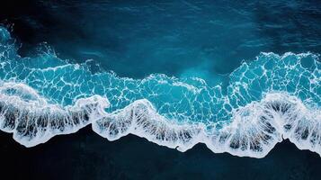 Aerial View of Ocean Waves Crashing on Shore Turquoise Water White Foam photo