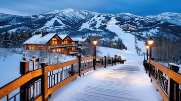 Snow covered walkway at twilight luxury cabins ski resort mountain backdrop photo