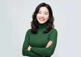 Asian woman in green sweater smiling photo