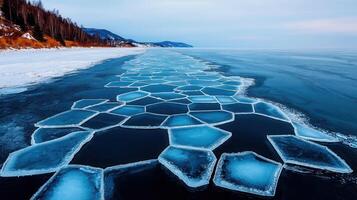 Stunning Aerial View of Geometric Ice Patterns on Frozen Lake Winter Landscape photo