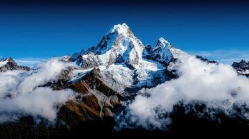 Majestic Snow Capped Mountain Peak Soaring Above Cloudscape Dramatic Landscape Photography photo