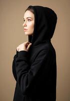 A woman in a black hoodie photo
