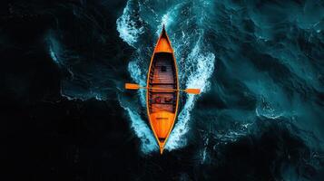 Aerial View of Wooden Rowboat on Dark Ocean Water Dramatic Waves photo