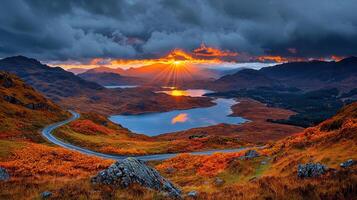 Dramatic Sunset over Scottish Highlands Winding Road Autumn Colors Scenic Lake View photo